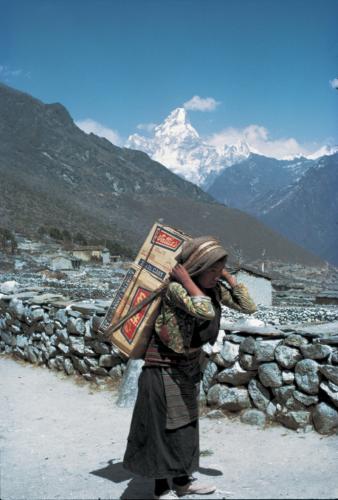 Carrying building supplies in Nepal.  All supplies need to be carried in as there is no vehicle access in the mountainous regions of Nepal