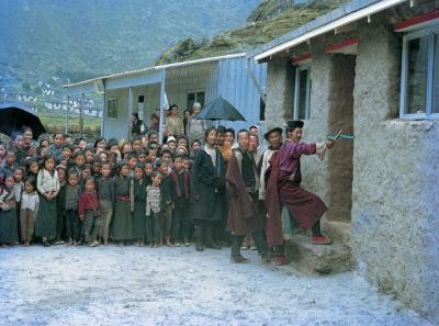 The whole community assembles to celebrate the opening of a new facility.